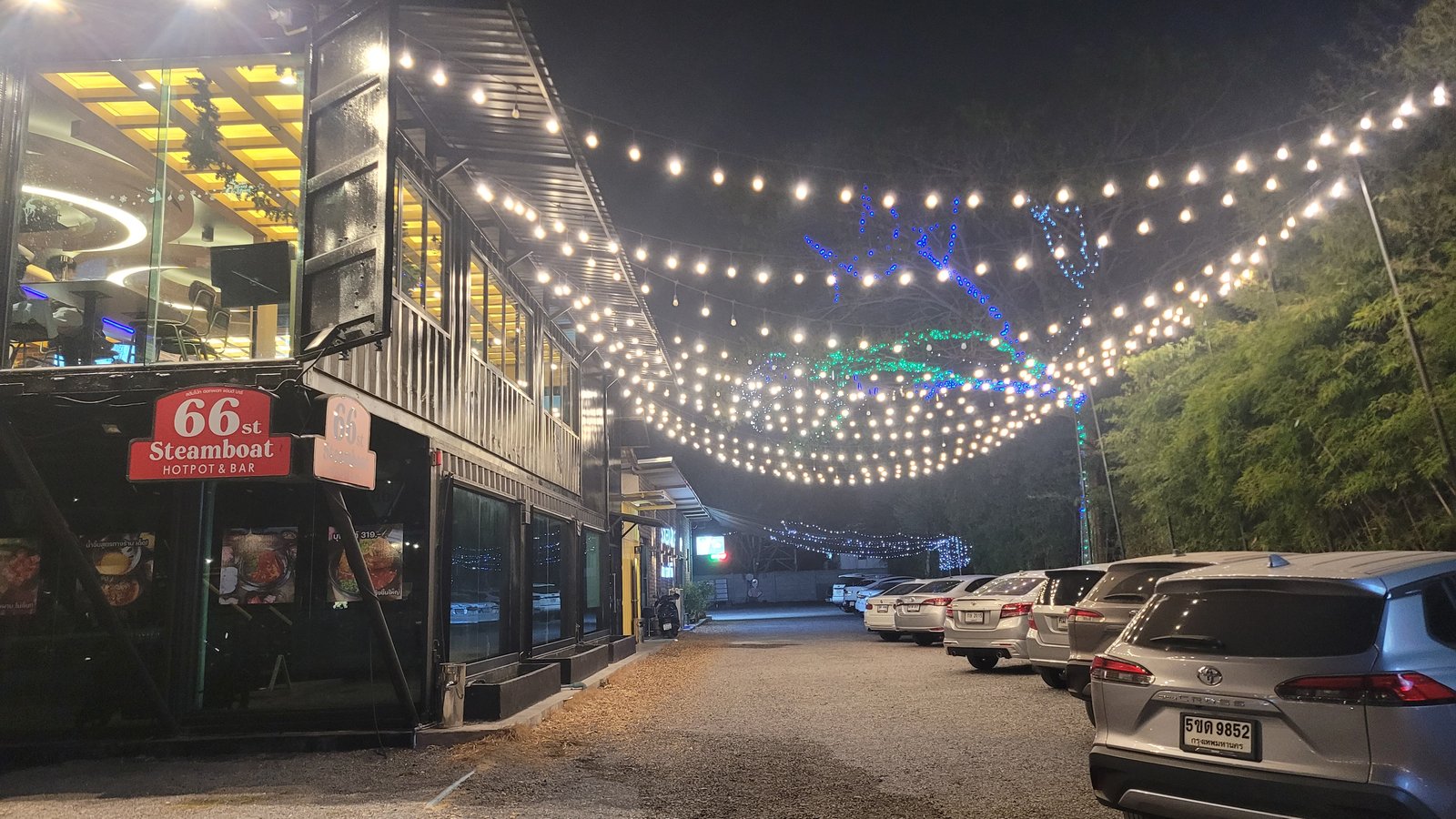 Evening atmosphere with string lights along the venue