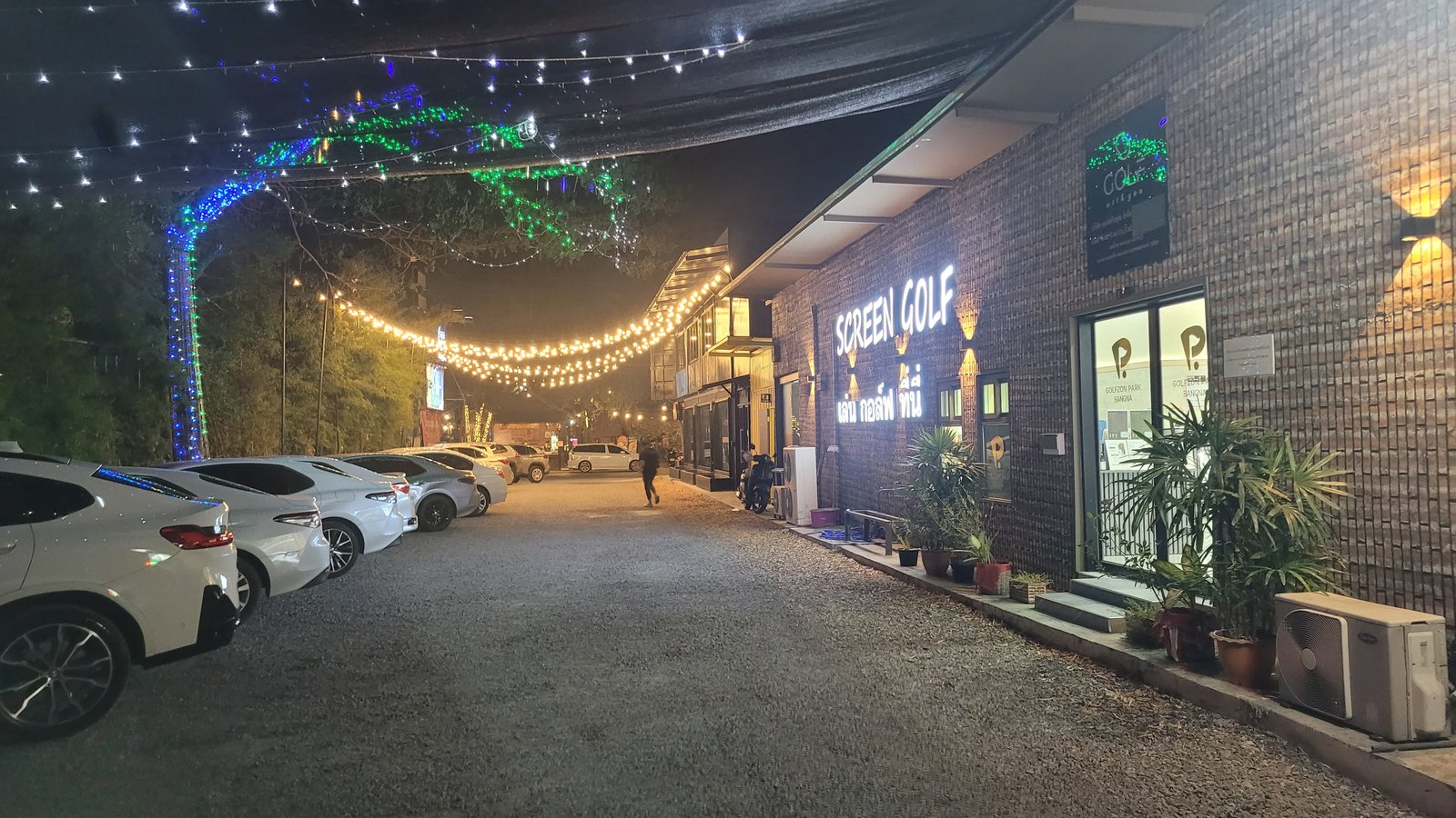 Golfzon Park Bangna at night, lit walkway