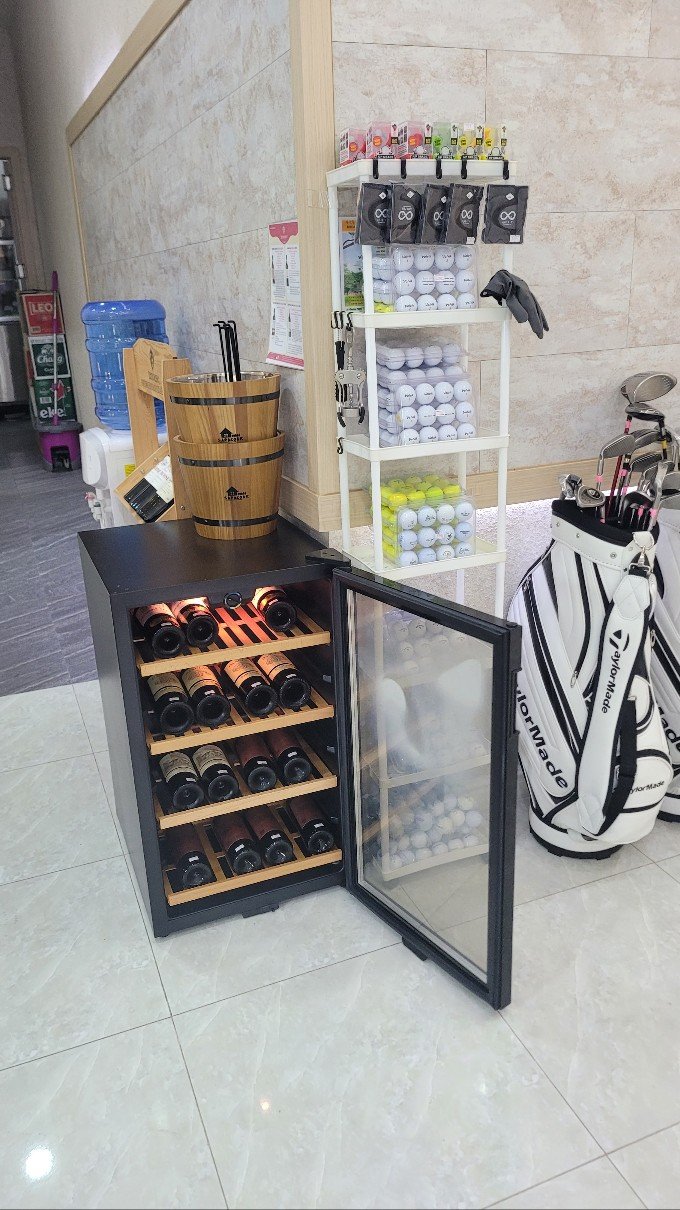 Wine cellar with golf accessories
